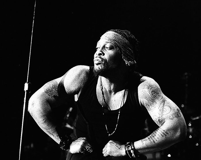 Performer posing confidently on stage.