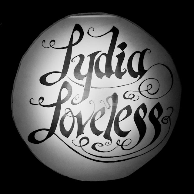 Decorative 'Lydia Loveless' black script logo.