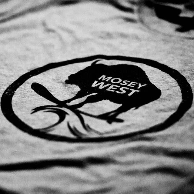 Gray shirt with black "Mosey West" logo.