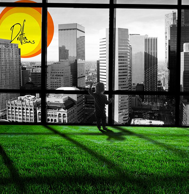 Child looking out at city skyline.