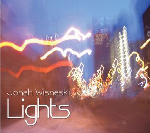 Blurry city lights with text overlay.