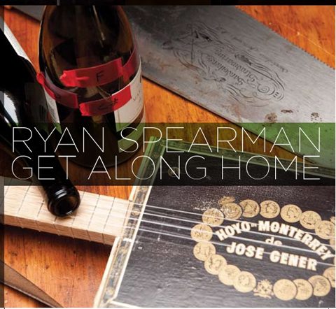 Bottles and music instruments on wooden surface.