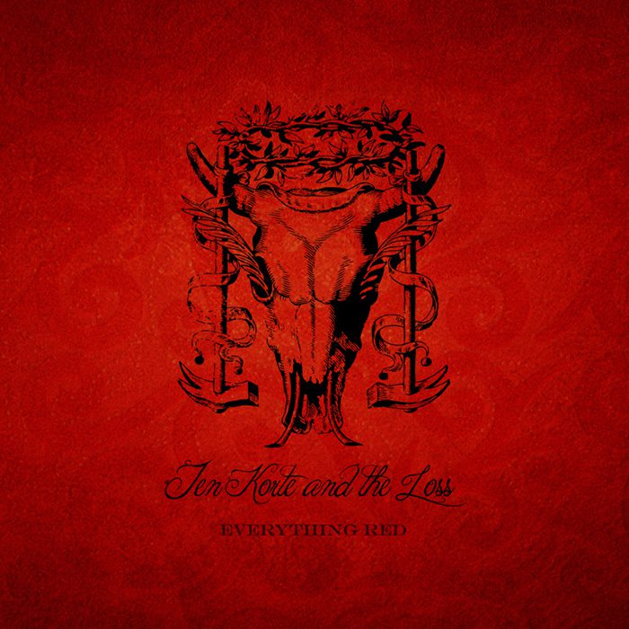 Red album cover with intricate black design.