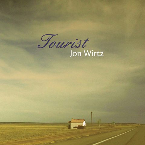 Desert road with distant house, "Tourist" text.