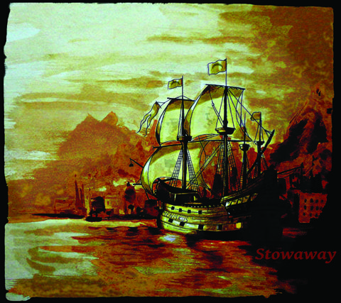Old sailing ship near rocky coastline.