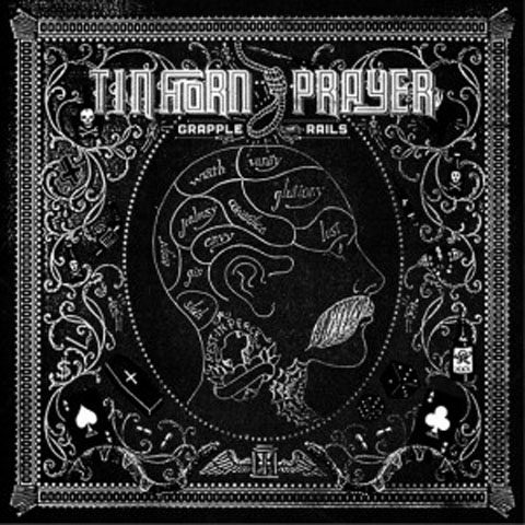 Decorative album cover with intricate black design.