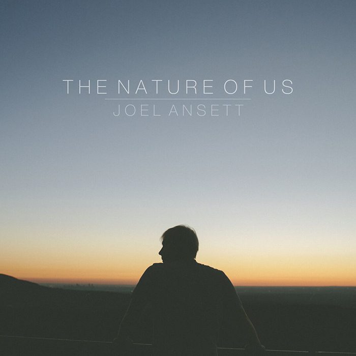 Silhouette of person against sunset sky.