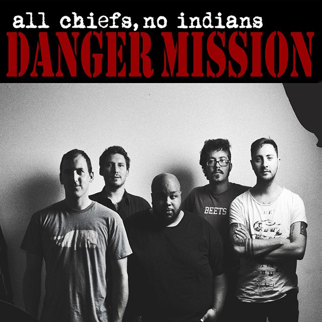 Band members posing in black and white.