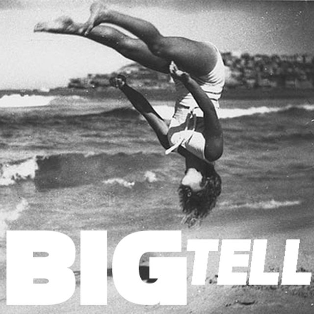 Person flipping on a beach, "BIG TELL".