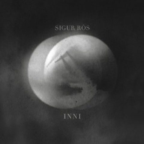 Abstract album cover with circular design.