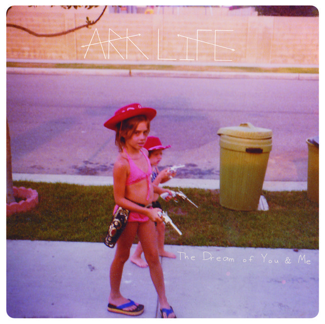 Children in swimsuits with toy guns outside.
