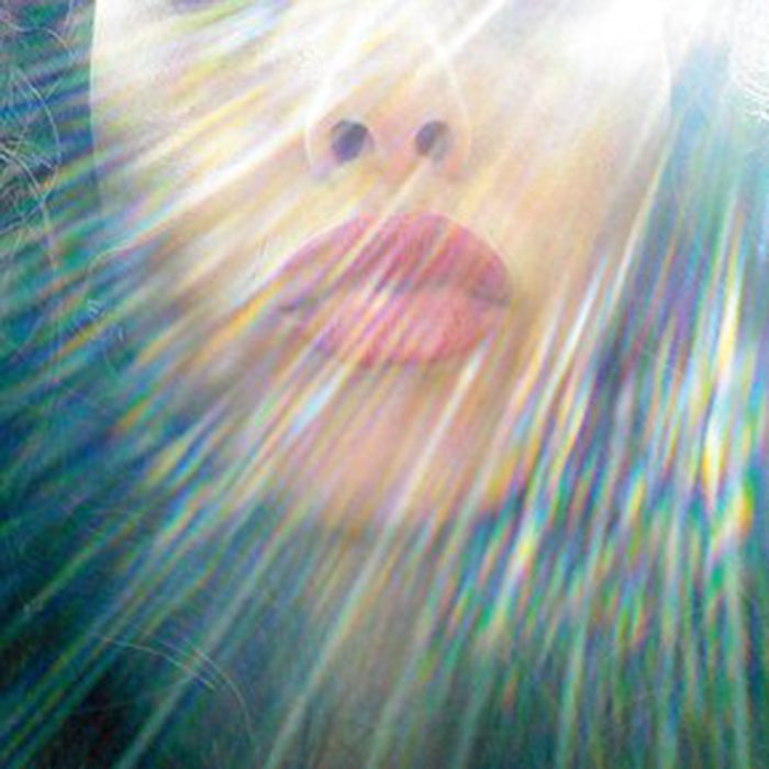 Face with colorful light rays effect.