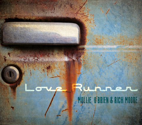 Rusty car door with "Love Runner" text.
