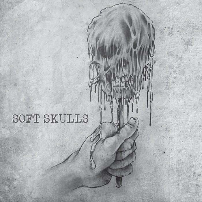 Hand holding melting skull illustration.