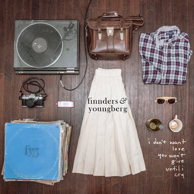 Vintage items arranged on wooden floor.