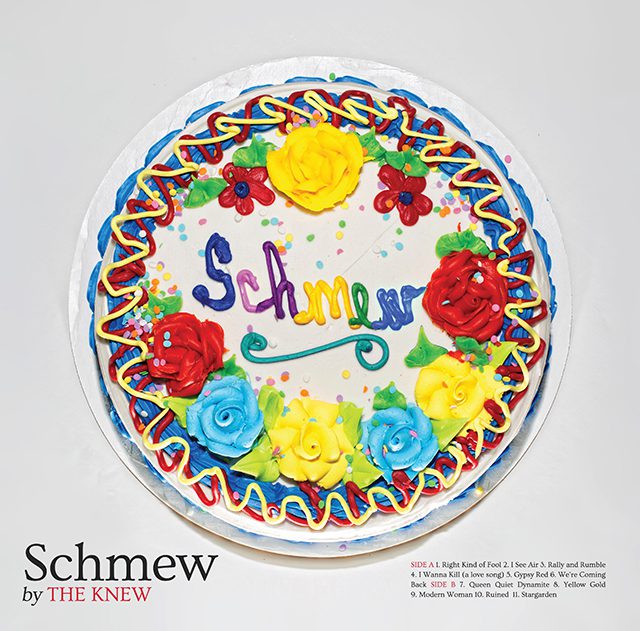 Colorful cake with decorative icing flowers.