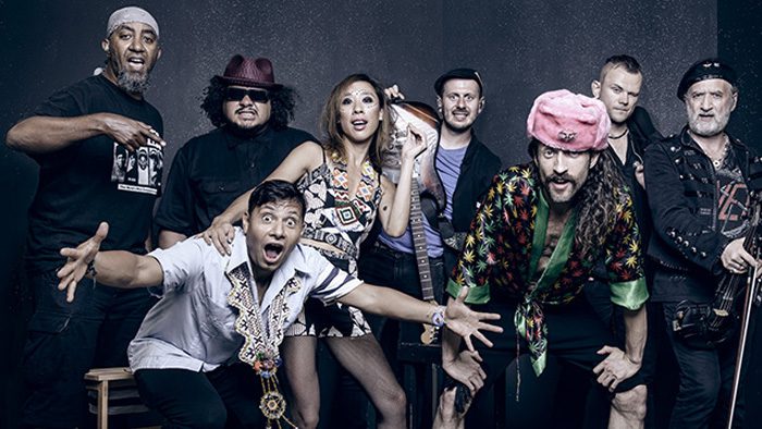Group of diverse people posing enthusiastically.