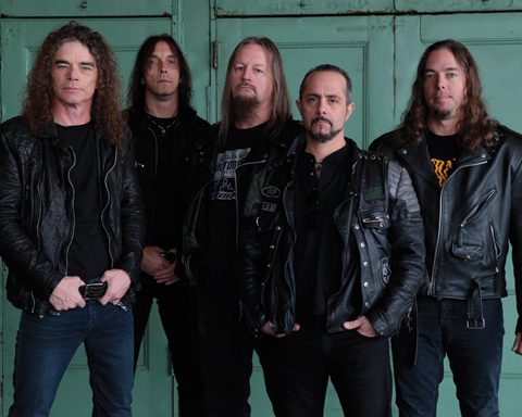 Five men in black leather jackets.