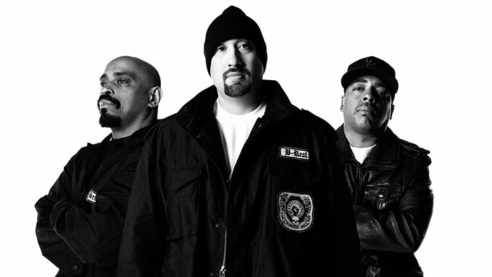 Three men in black and white portrait.