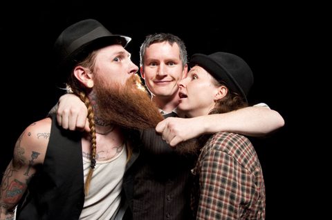 Three people posing with long beard.