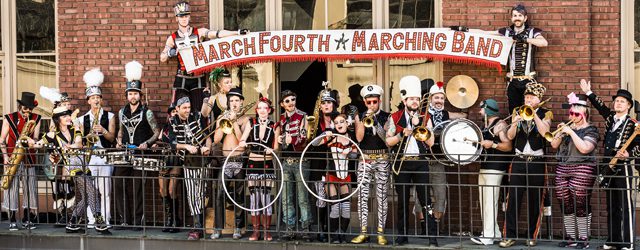 Marching band posing with various musical instruments.