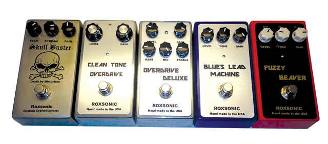 Five Roxsonic guitar effect pedals in a row.