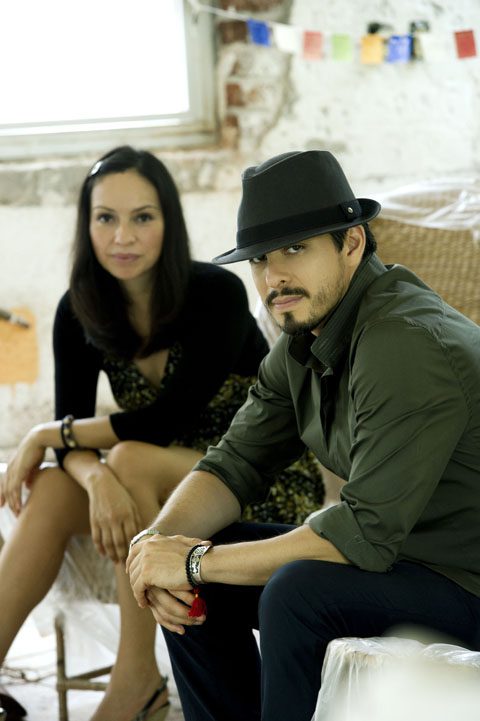 Man and woman sitting, casual indoor setting.