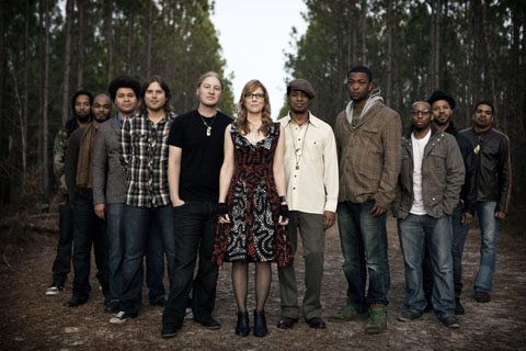 A group of people standing outdoors.