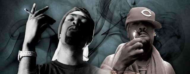Two men with hats and smoke background.
