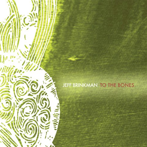 Green abstract album cover with intricate design.
