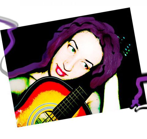 Person with purple hair holding a guitar.