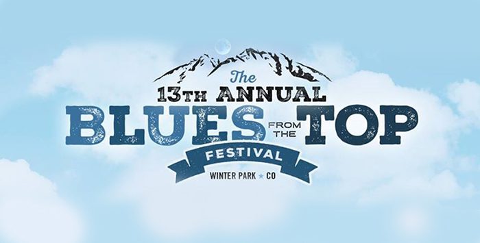 Blues festival logo with mountain background.