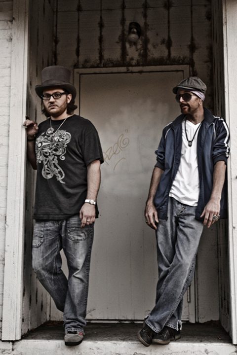 Two men standing in front of doorway.