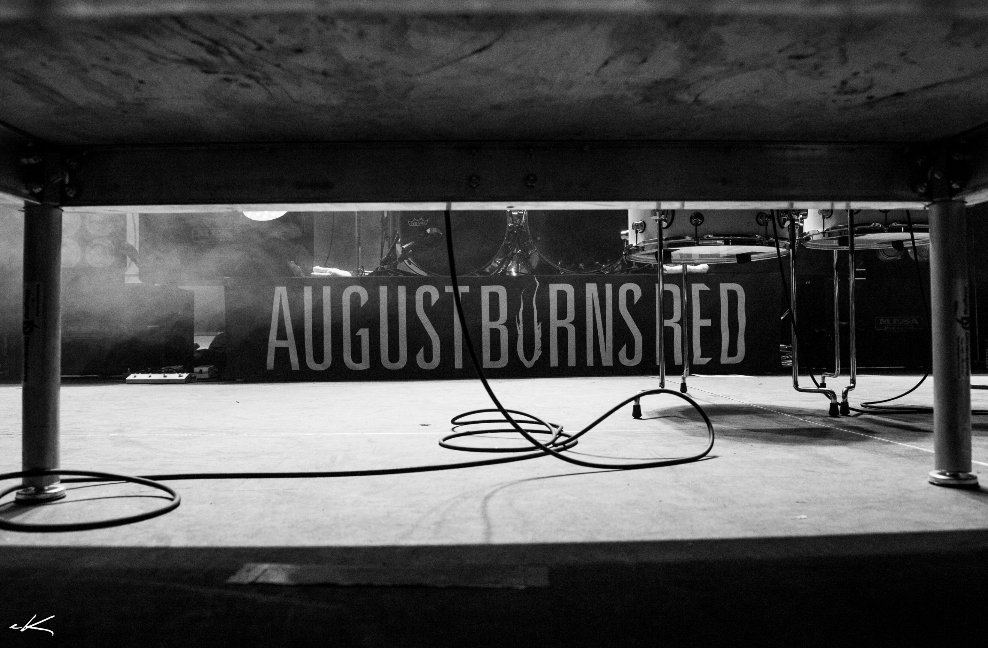 Concert stage with "August Burns Red" banner.