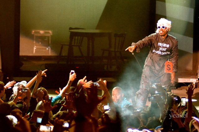 Performer on stage pointing at audience.