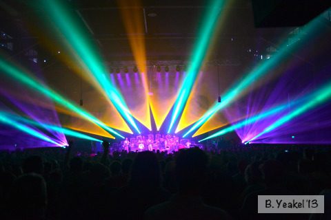 Concert stage with vibrant colorful lights.