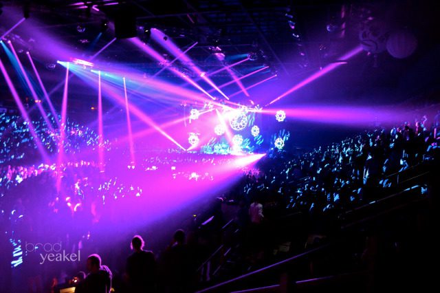 Concert with vibrant stage lights and crowd.