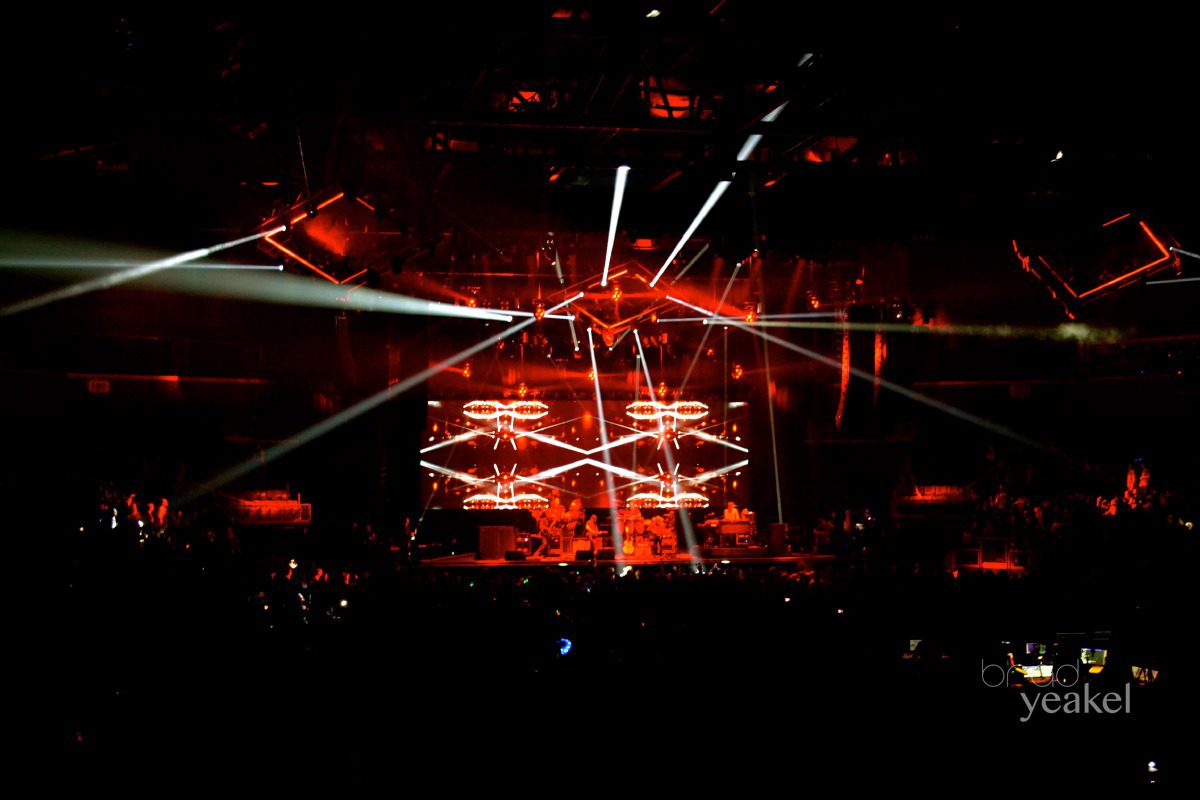 Concert stage with striking red lighting effects.