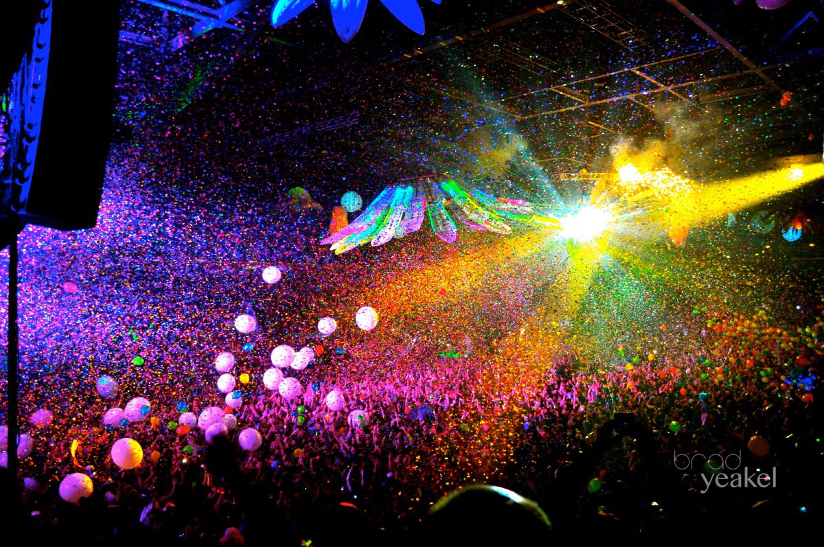 Colorful concert with lights and confetti.