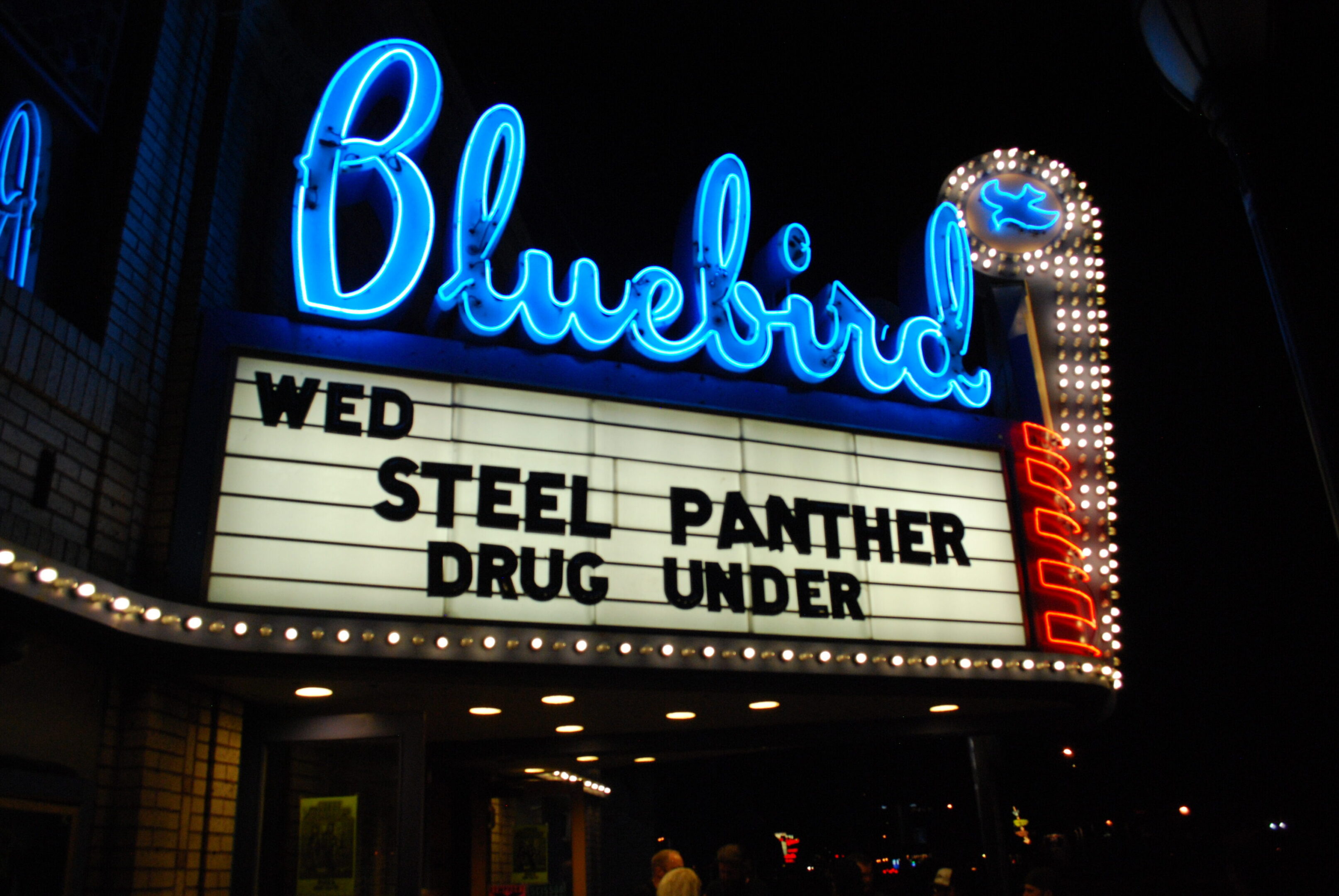Bluebird theater marquee with concert details.