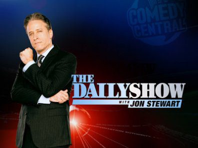 TV show host with "The Daily Show" logo.