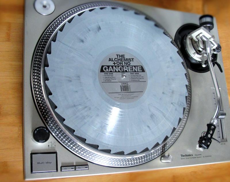 Turntable with Gangrene record on platter.