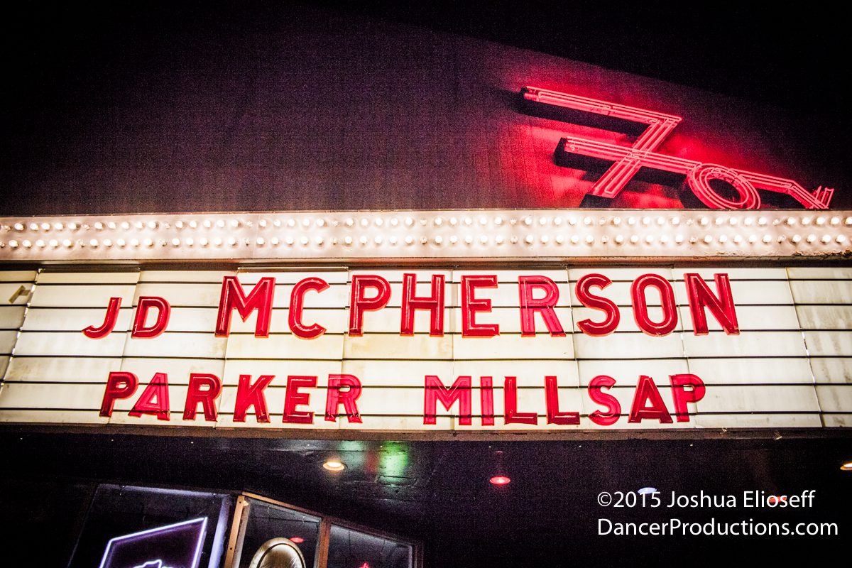 Marquee sign with band names in lights.
