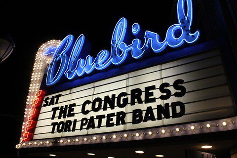 Bluebird Theater marquee with band names displayed.
