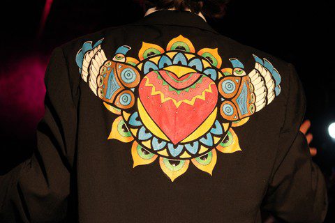 Jacket with colorful heart and wing design.