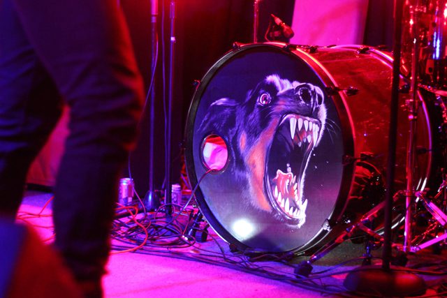 Drum with fierce animal artwork design.