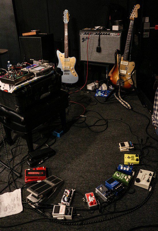 Guitars and effect pedals in music studio.