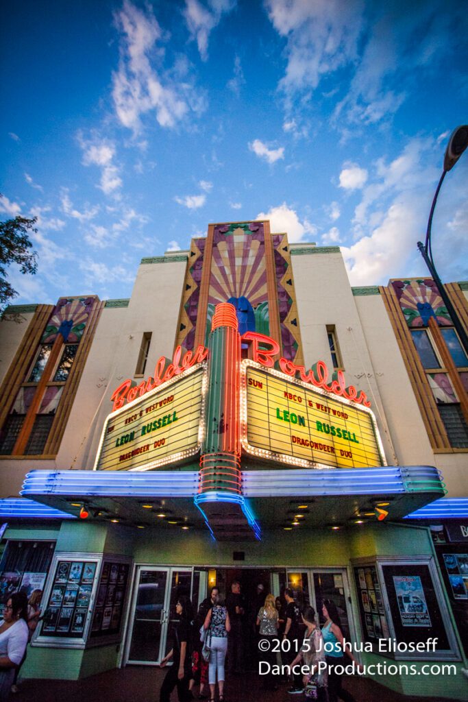 Art deco theater facade with neon lights.