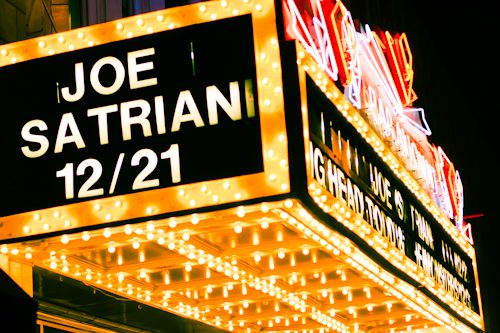 Theater marquee with Joe Satriani concert date.