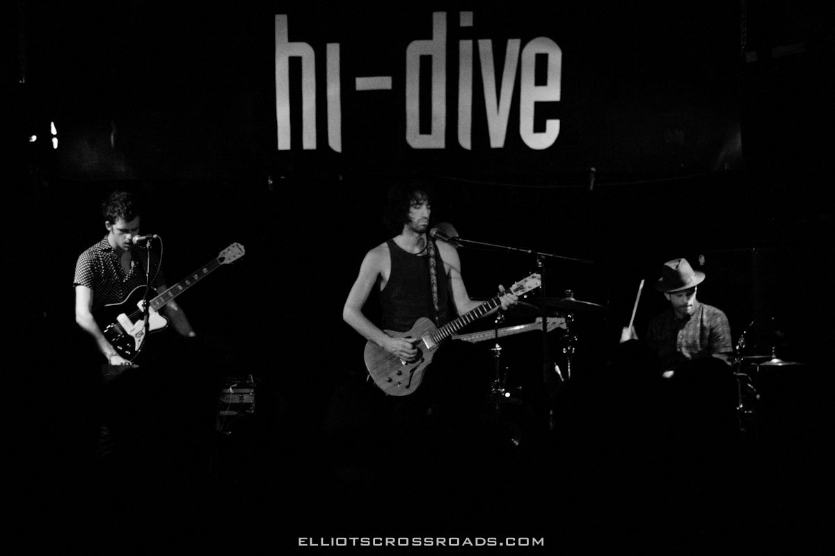 Band performing on stage at hi-dive venue.